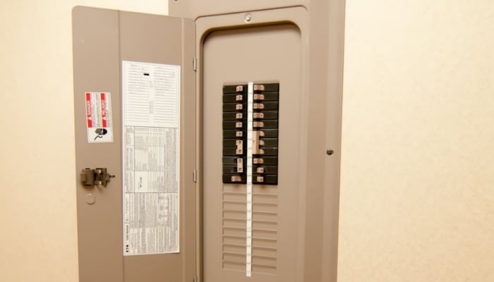 circuit breaker box on tan wall